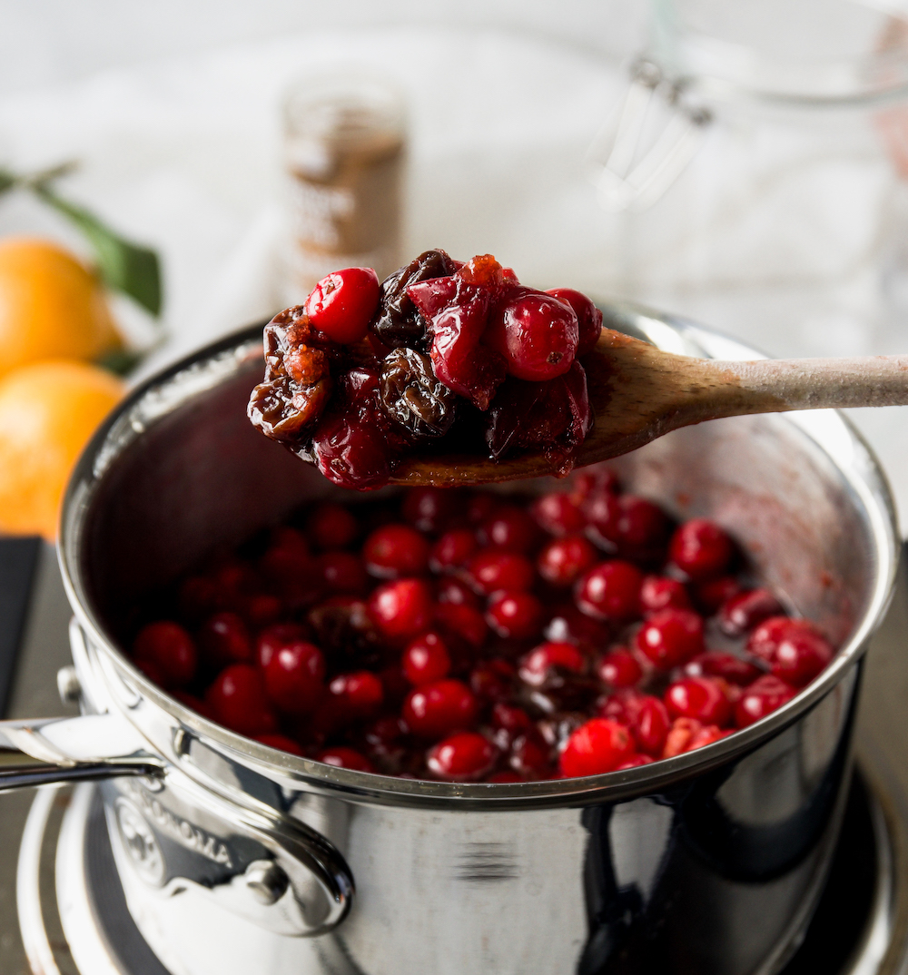 Finish cranberries on a wooden spoon.