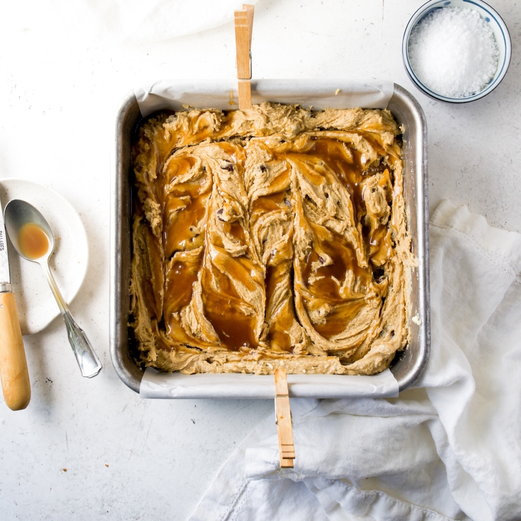 Blondie batter with caramel on top.