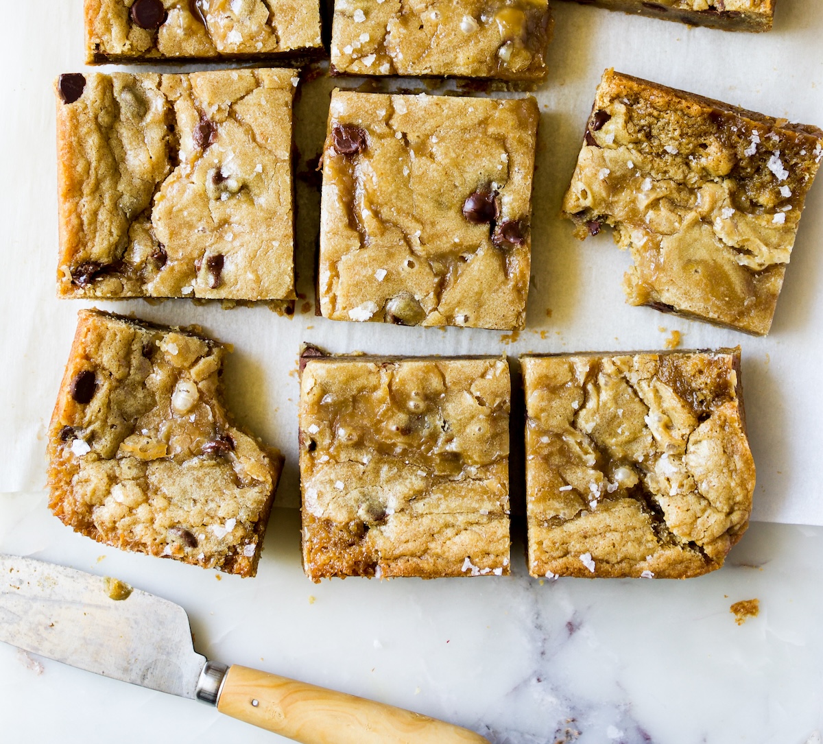 Blondies on a marble surface.