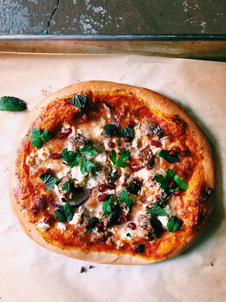 harissa pizza with north african sausage, pomegranates + feta | Recipe via DisplacedHousewife