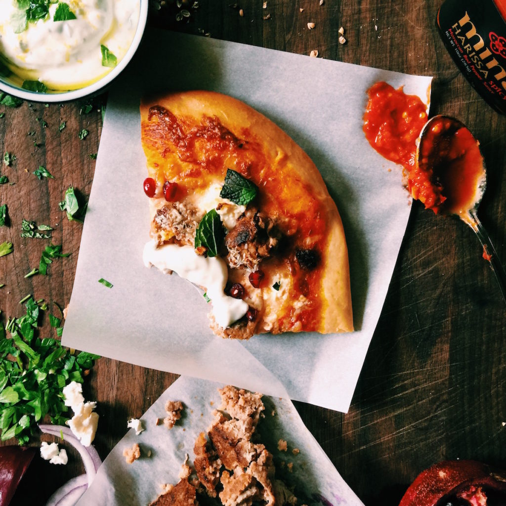 harissa pizza with north african sausage, pomegranates + feta | Recipe via DisplacedHousewife