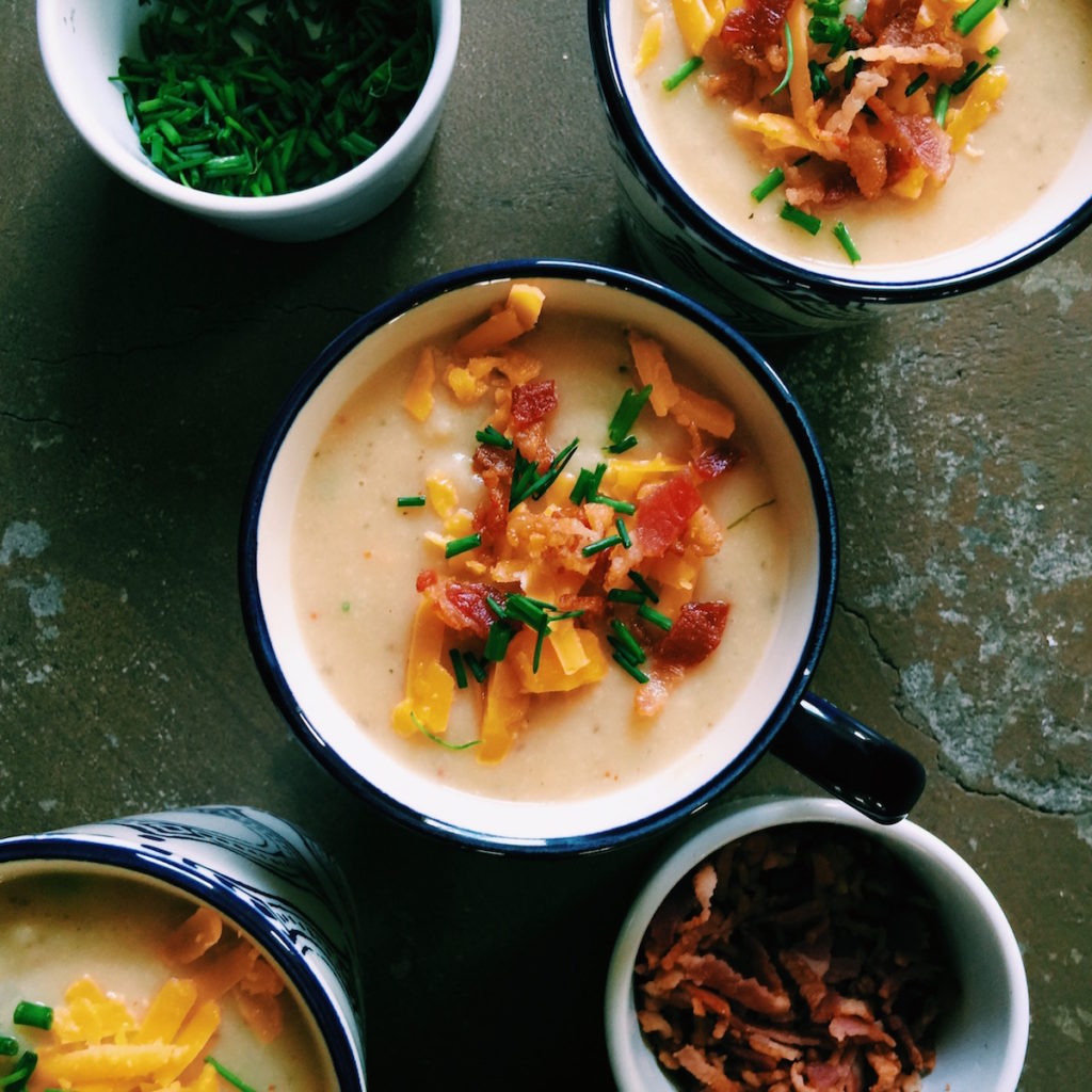 dirty baked potato soup | loaded with bacon and sharp cheddar and lightened up with broth + greek yogurt | Recipe via DisplacedHousewife