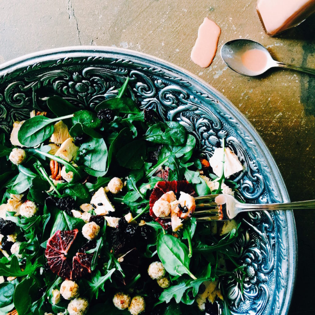 pecan-crusted goat cheese + braised chicken salad with blood orange tahini dressing
