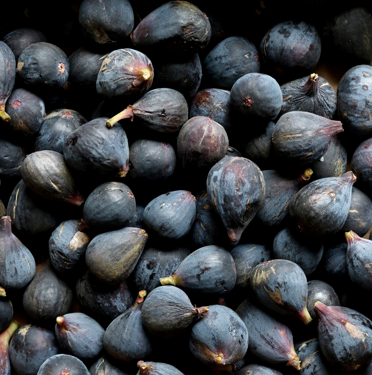 Close up photo of a bunch of figs.