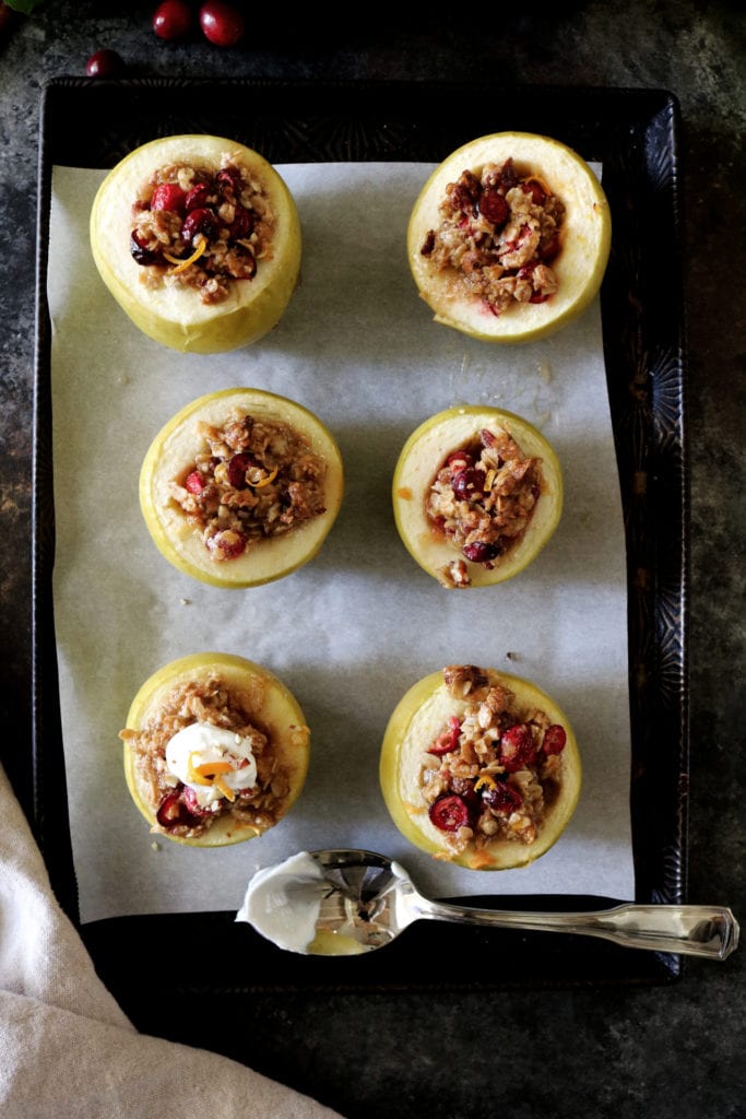 Cranberry Pecan Baked Apples | Recipe via DisplacedHousewife | cinnamon, tangerine zest, oatmeal, brown sugar, cranberries + pecans. Ready in under an hour! The perfect dessert. YUM!