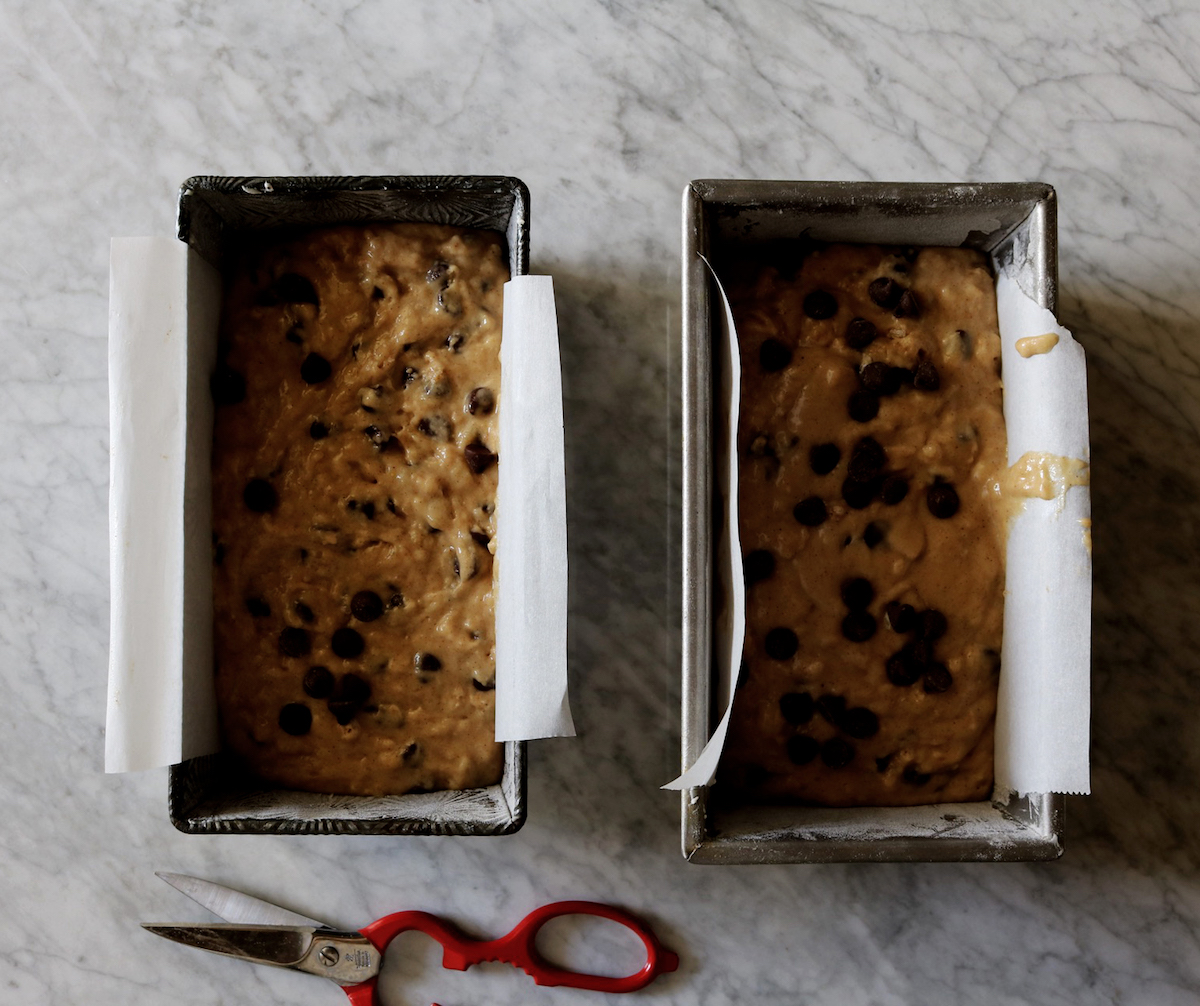 Two unbaked banana breads with chocolate chips.
