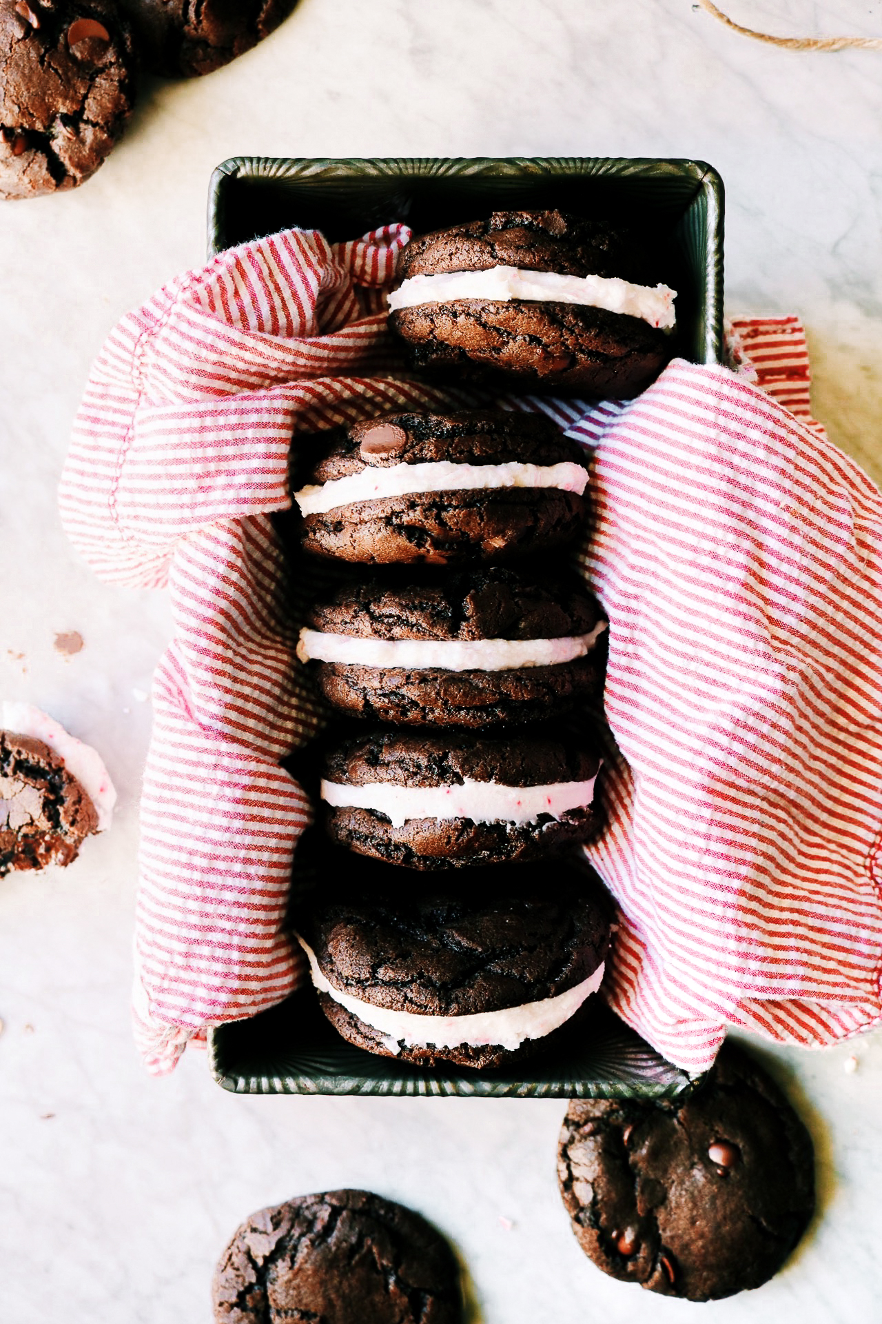 A bunch of chocolate peppermint sandwich cookies in a loaf pan.