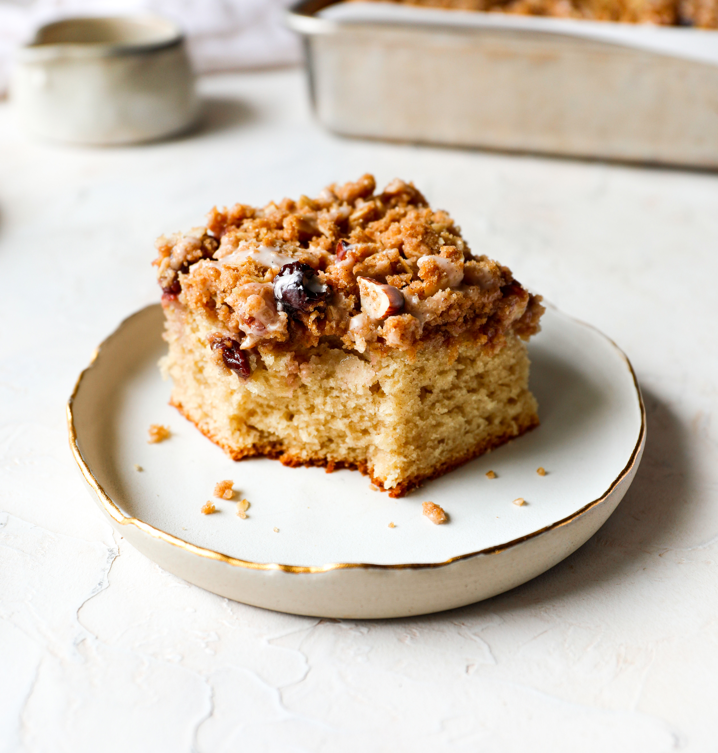 A piece of coffee cake with a bite out of it.