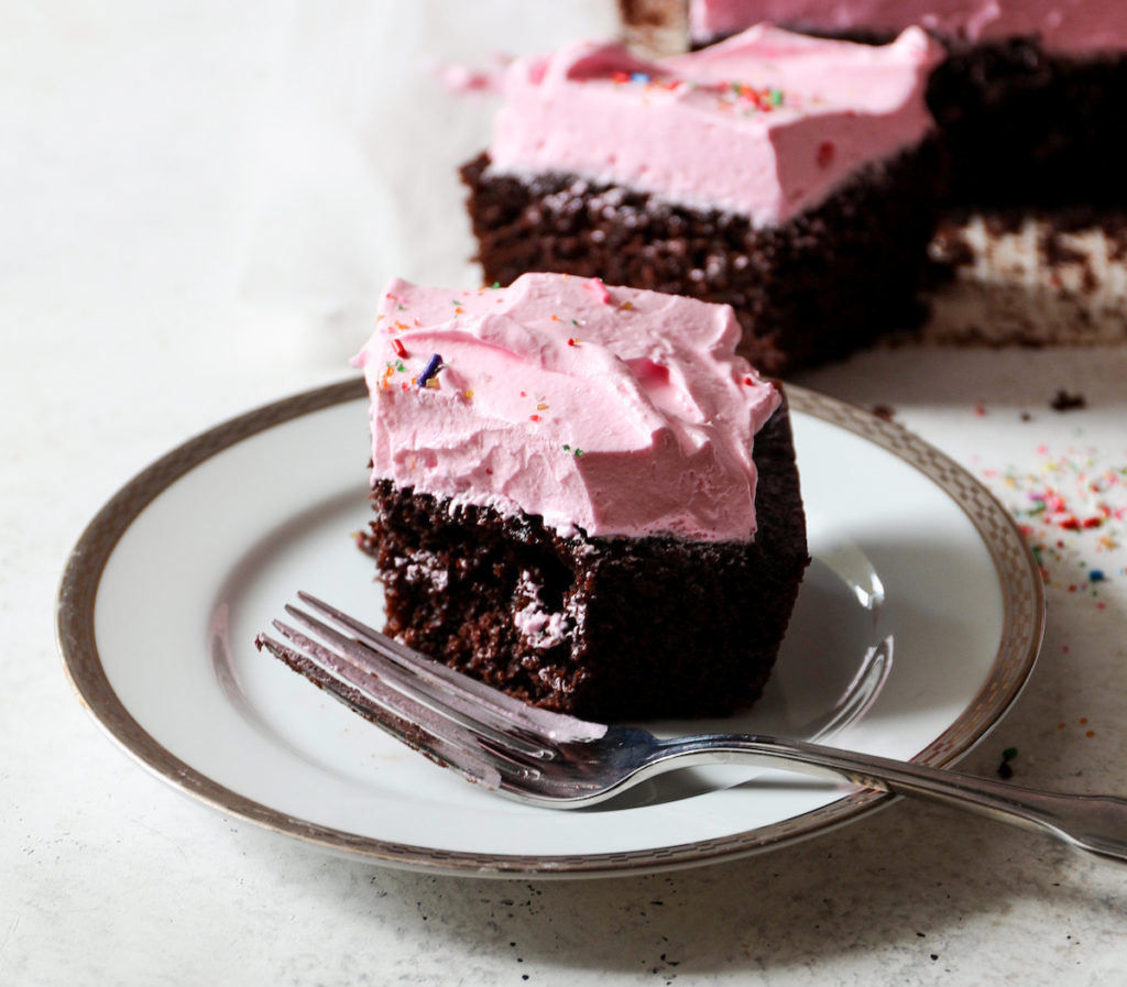 A piece of Chocolate Birthday Cake With Strawberry Marshmallow Frosting Recipe