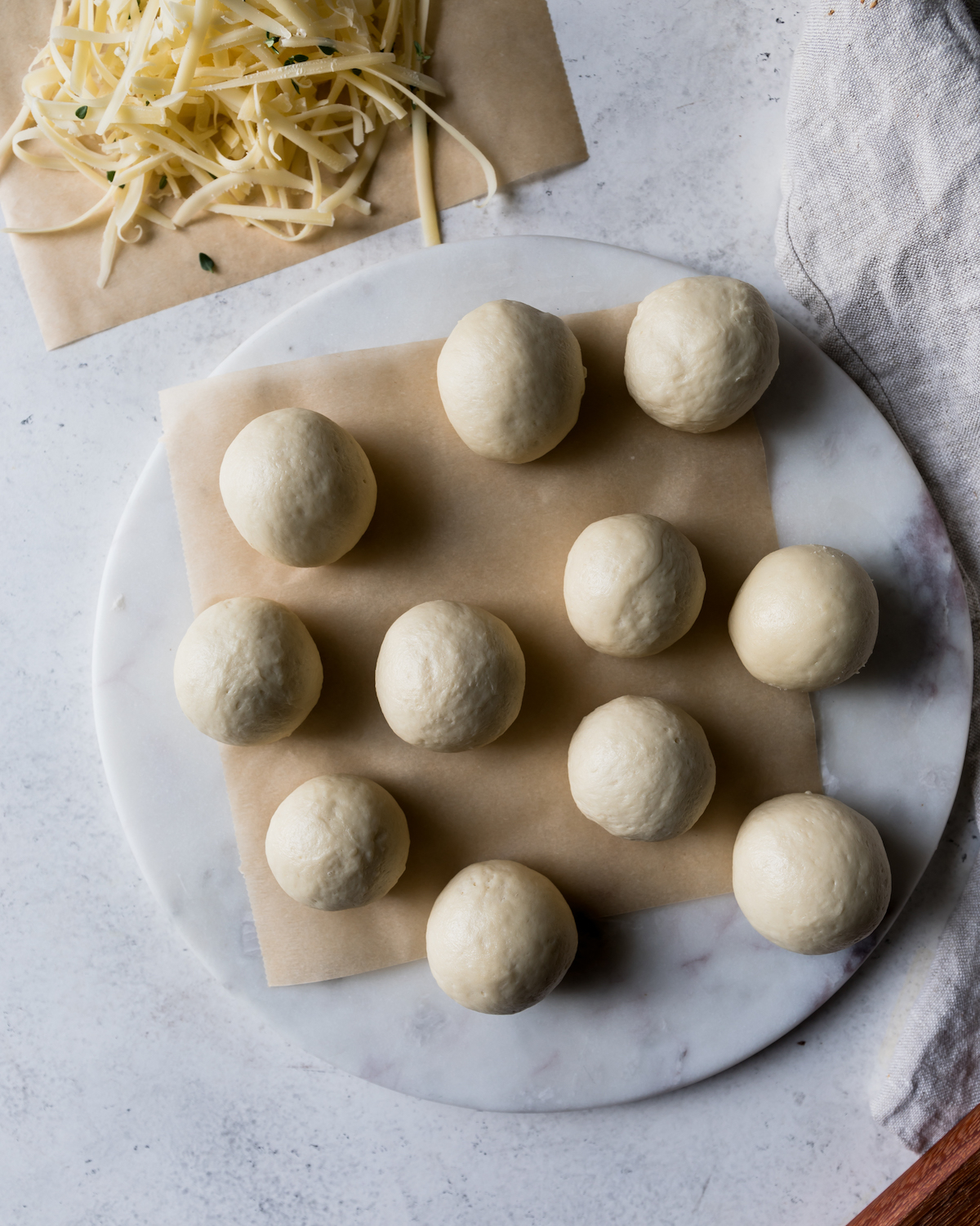 Dough balls on a marble background.