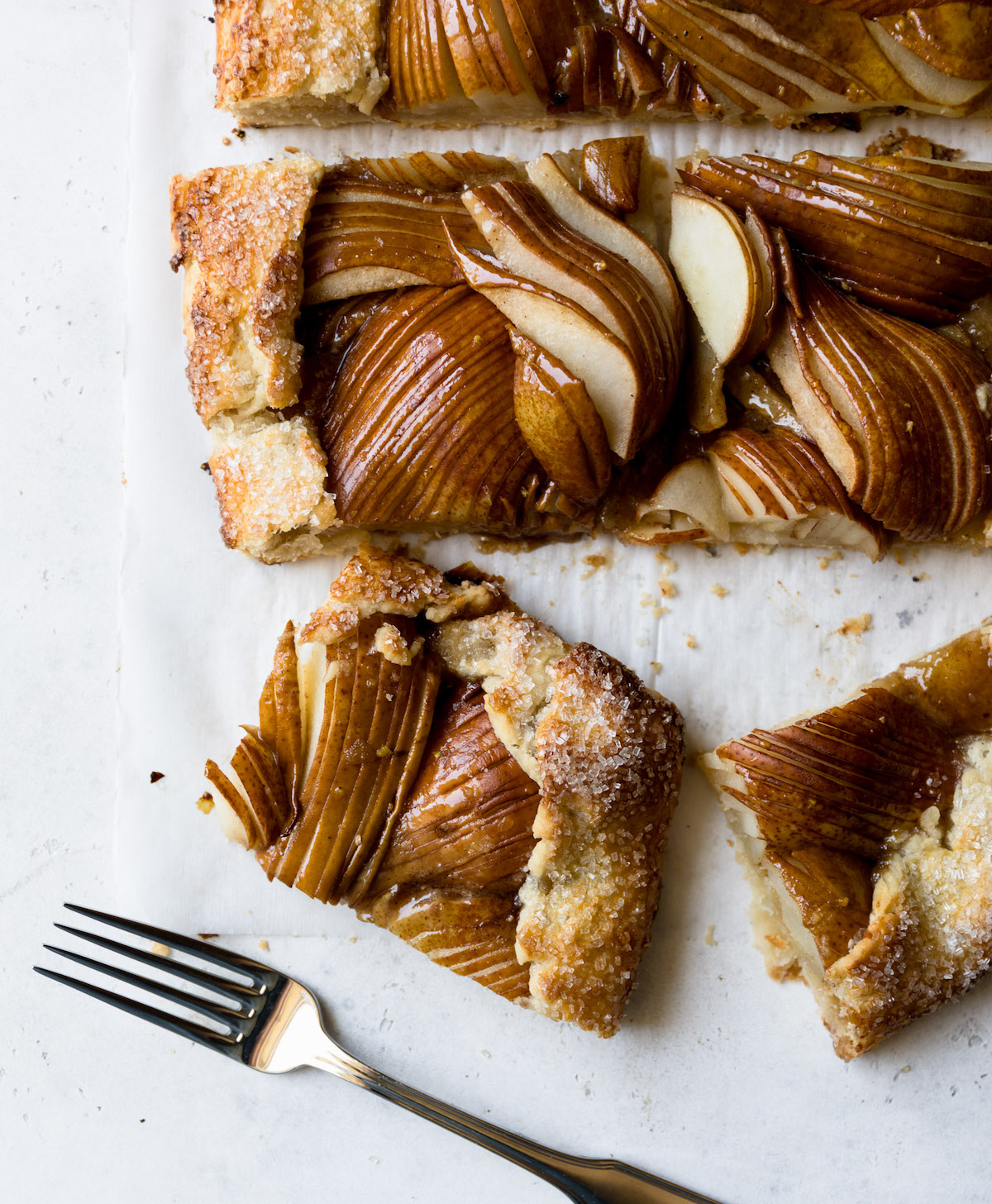 Pear crostata on a white surface.