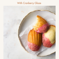 Vanilla Orange Madeleines dipped in Cranberry Glaze