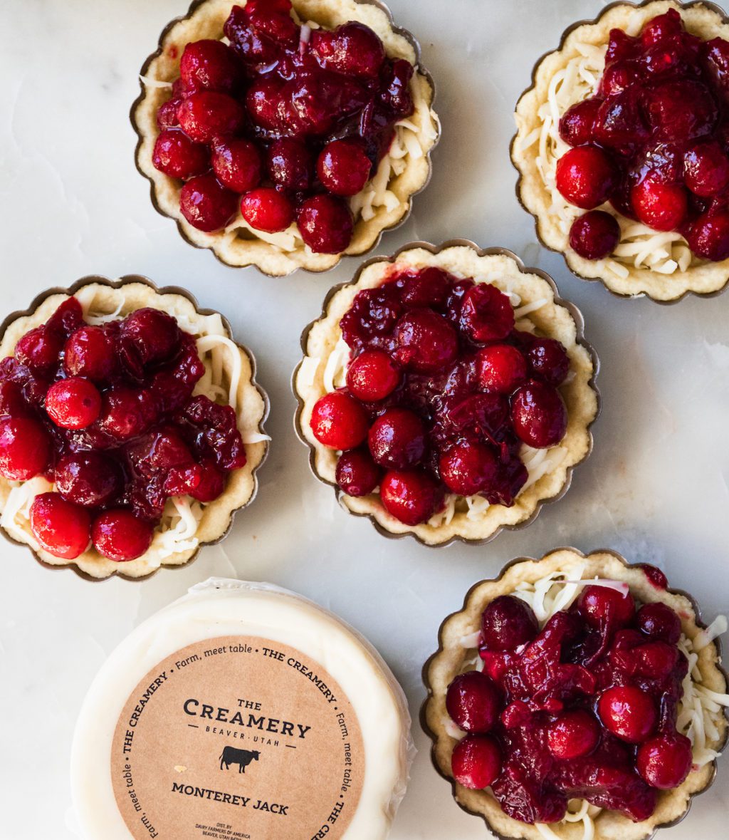 lots of cranberry tarts with cheese