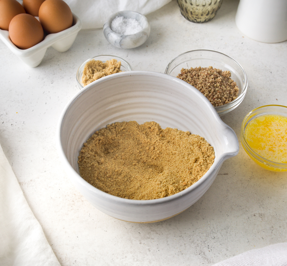 Ground up graham crackers in a bowl.