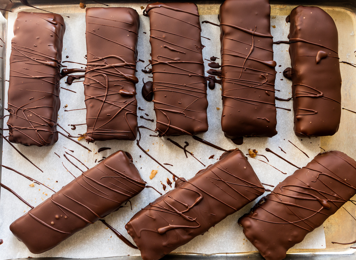 Eight perfectly  imperfect chocolate dipped granola bars.