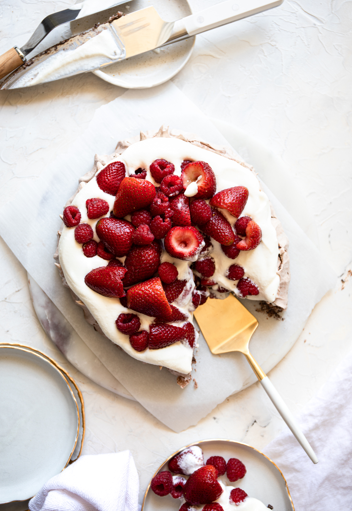 An  overhead  view of a pavlova with berries.