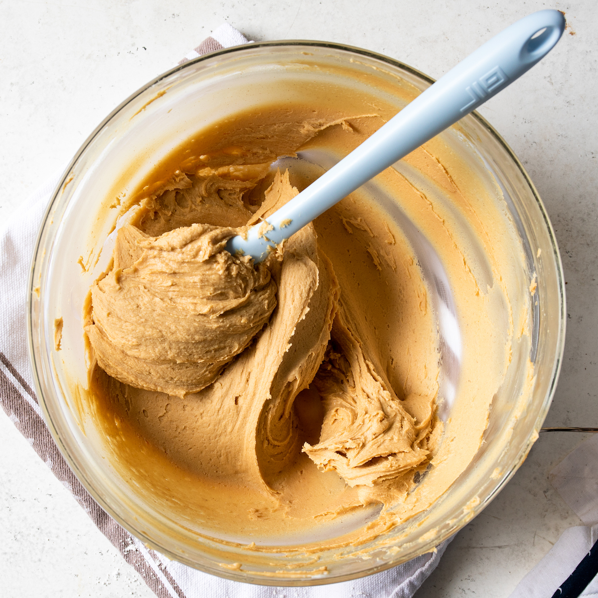 A bowl of delicious peanut butter frosting.