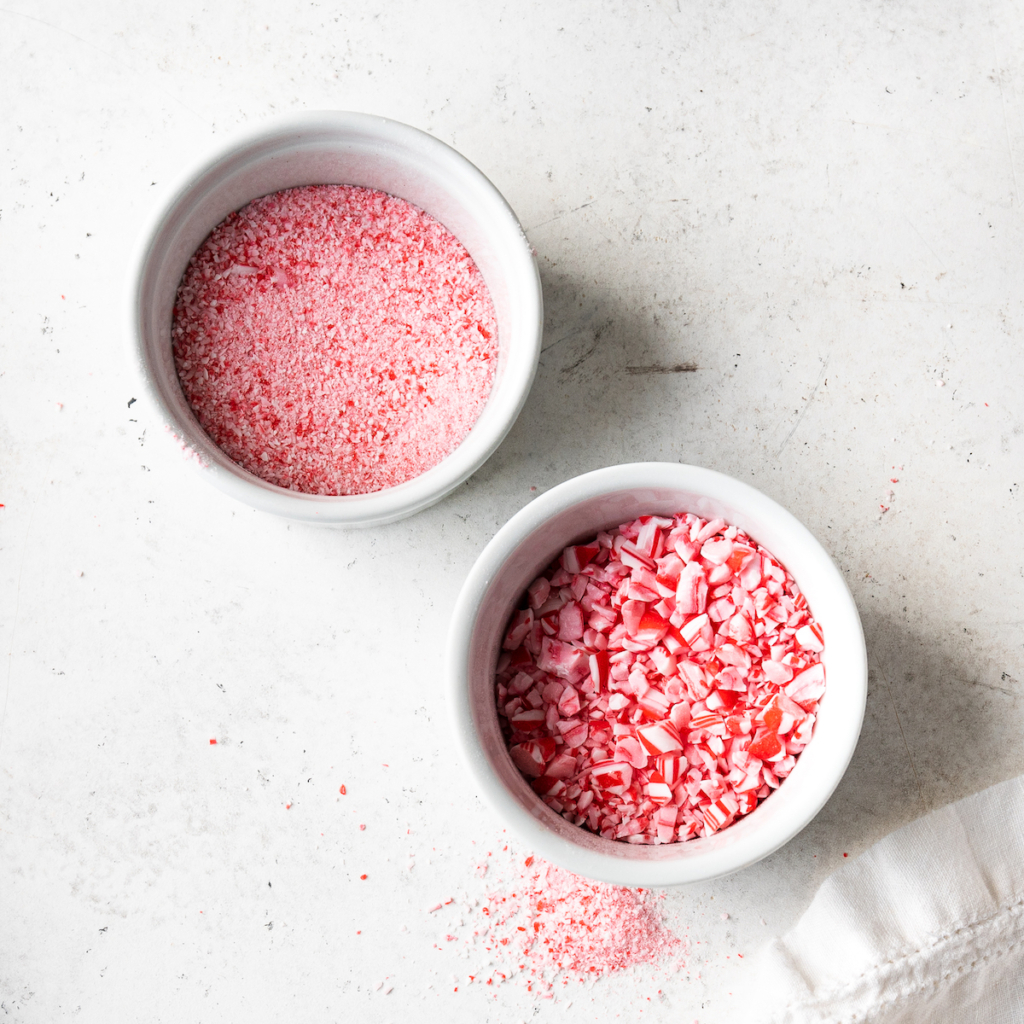 Two white bowls of crushed candy canes.
