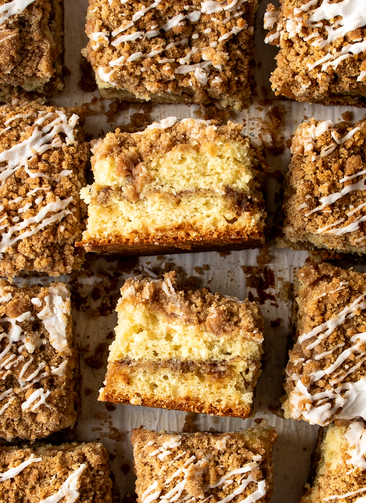 A close up shot of the side of two pieces of classic coffee cake.