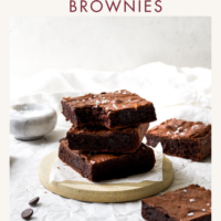 A stack of three brownies against a white background.