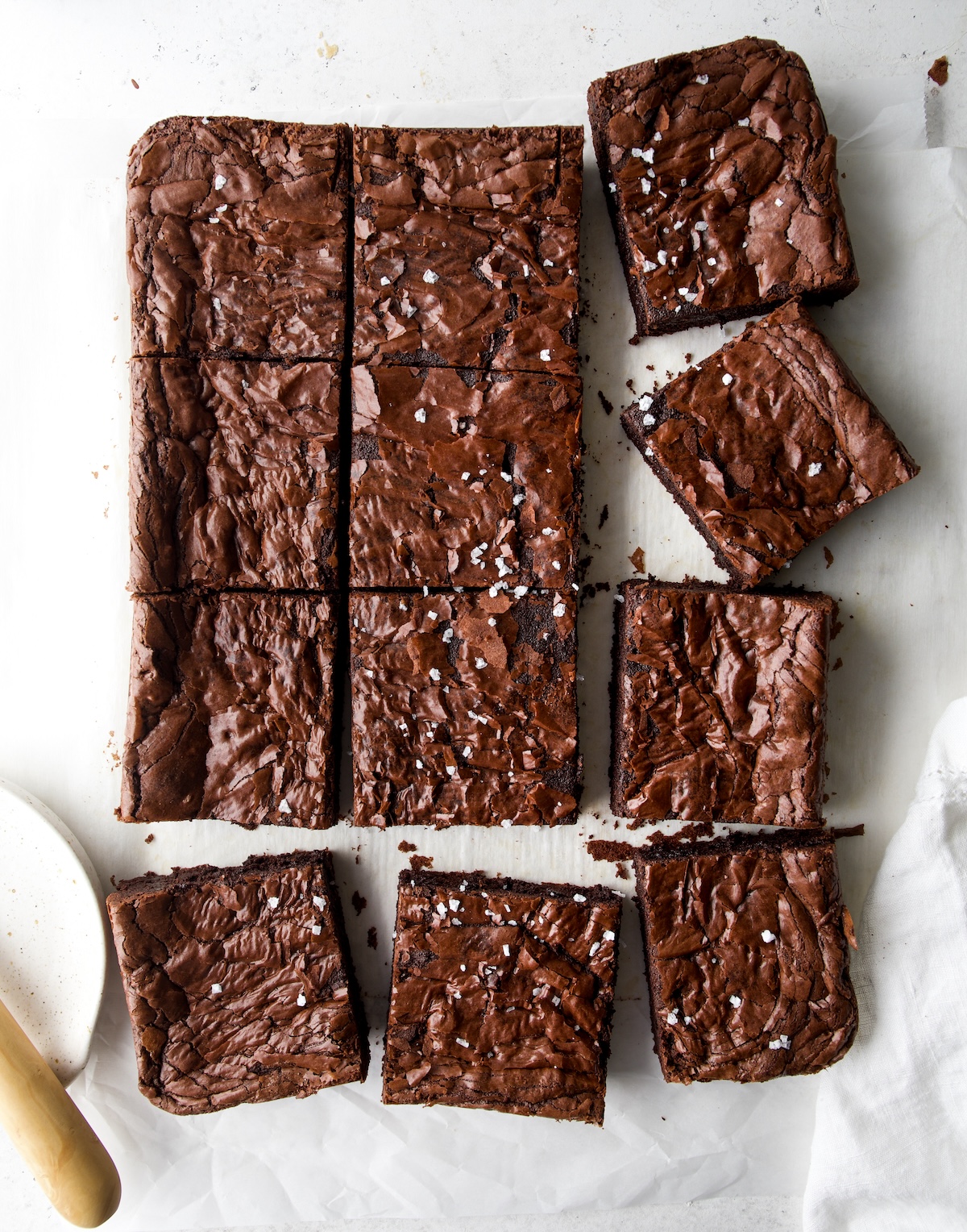 A whole batch of brownies cut into slices.