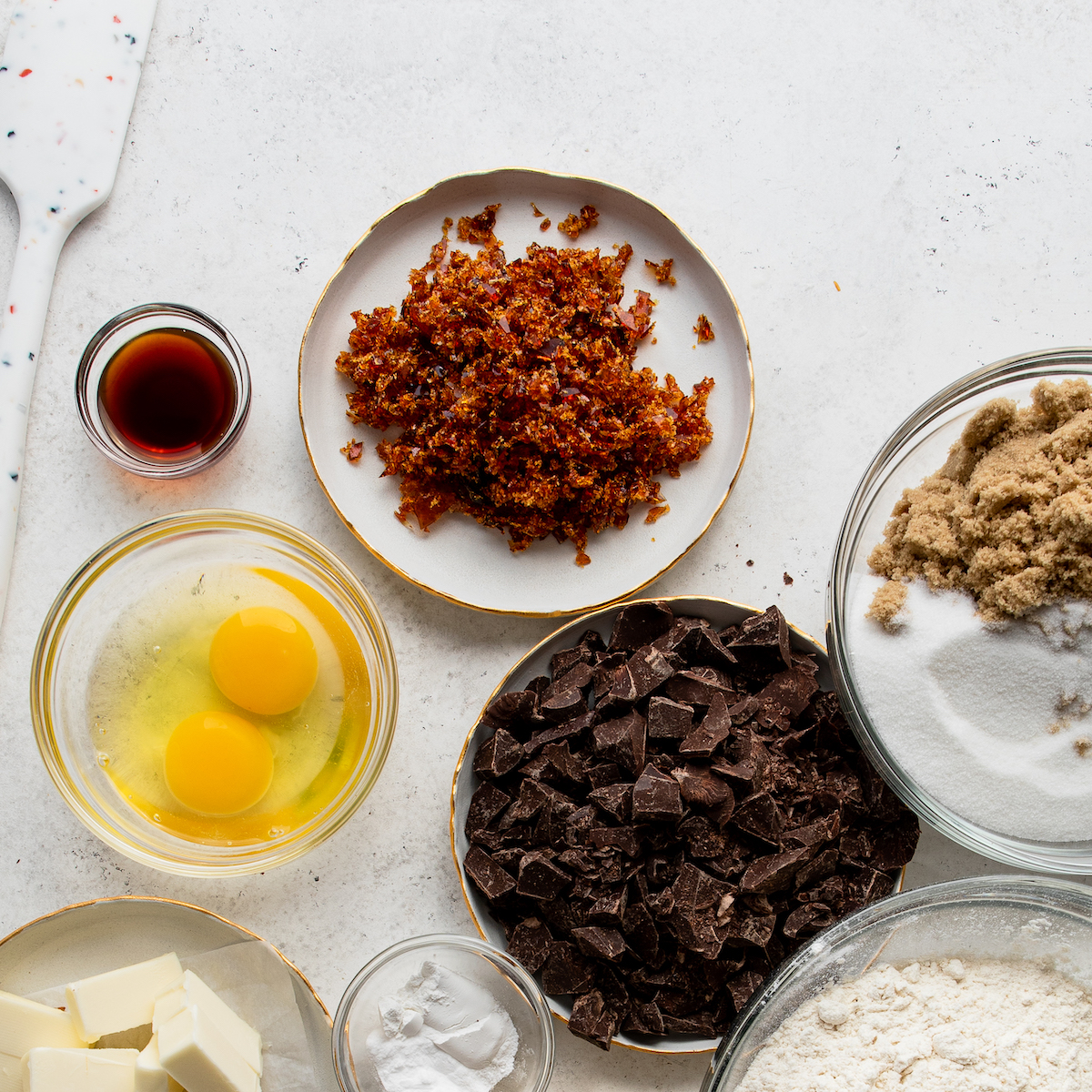 All the ingredients needed to make these cookies on a white surface.