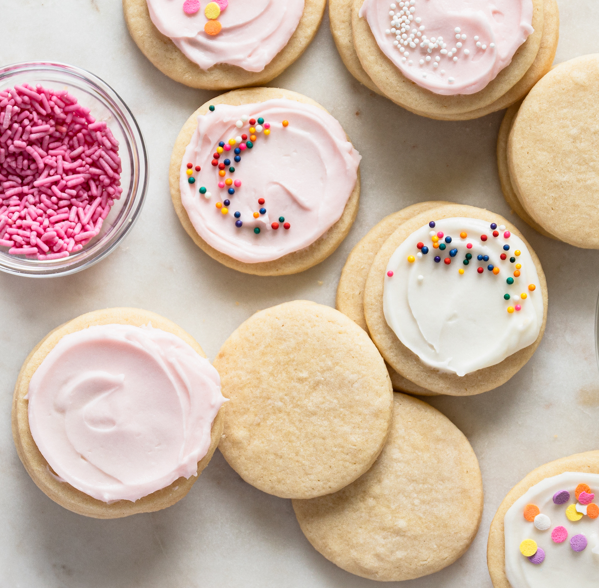 Sugar cookies with vanilla icing and without.
